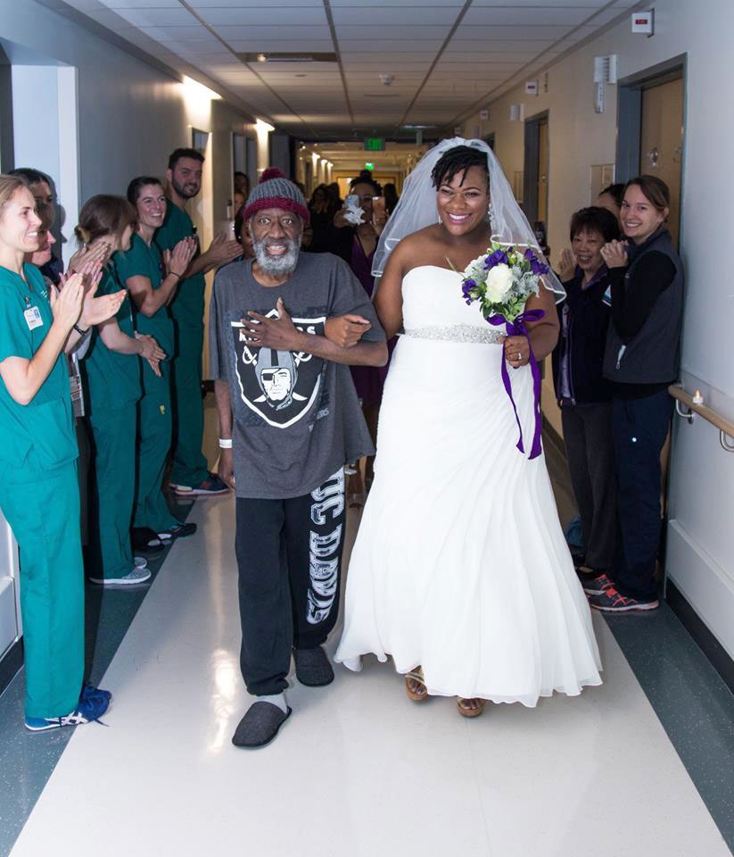 Preston Rolan walking Vieneese Stanton down the aisle