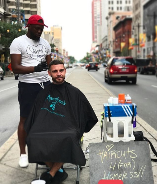 Brennon Jones giving a haircut