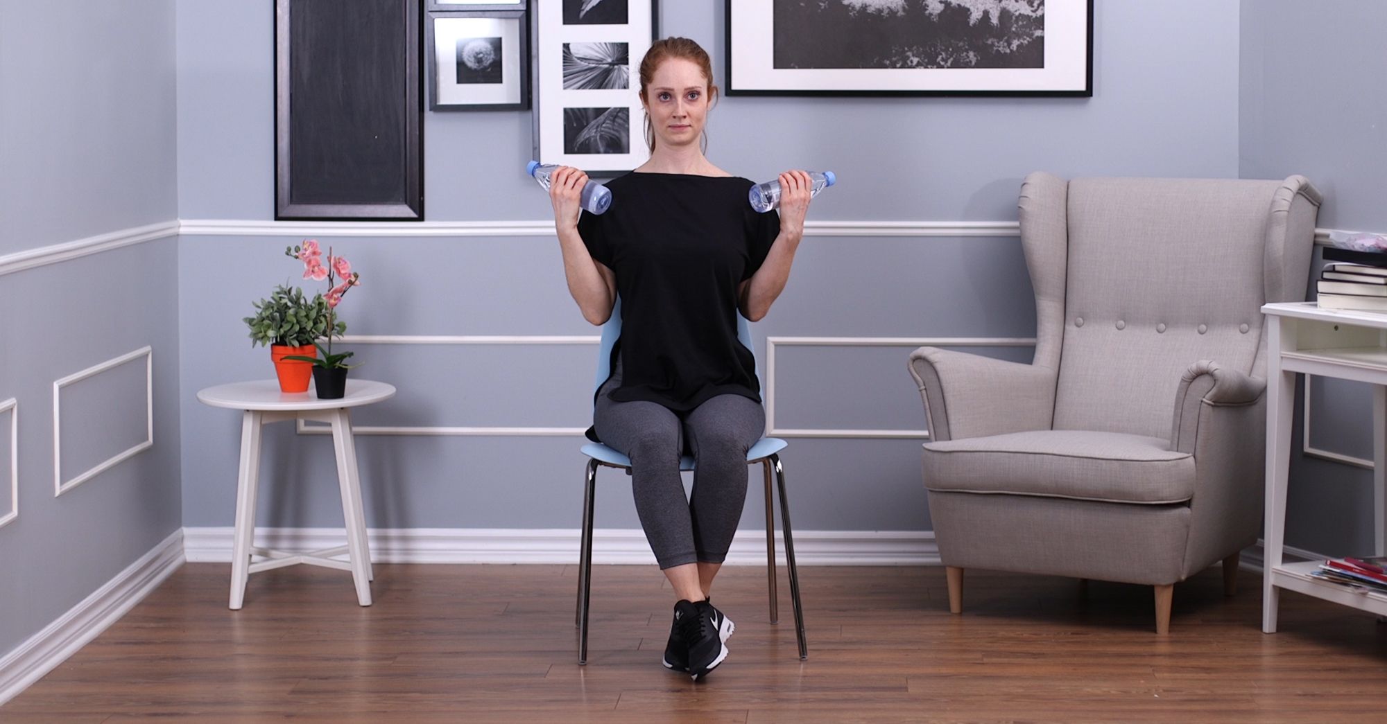 Woman doing a water bottle curl