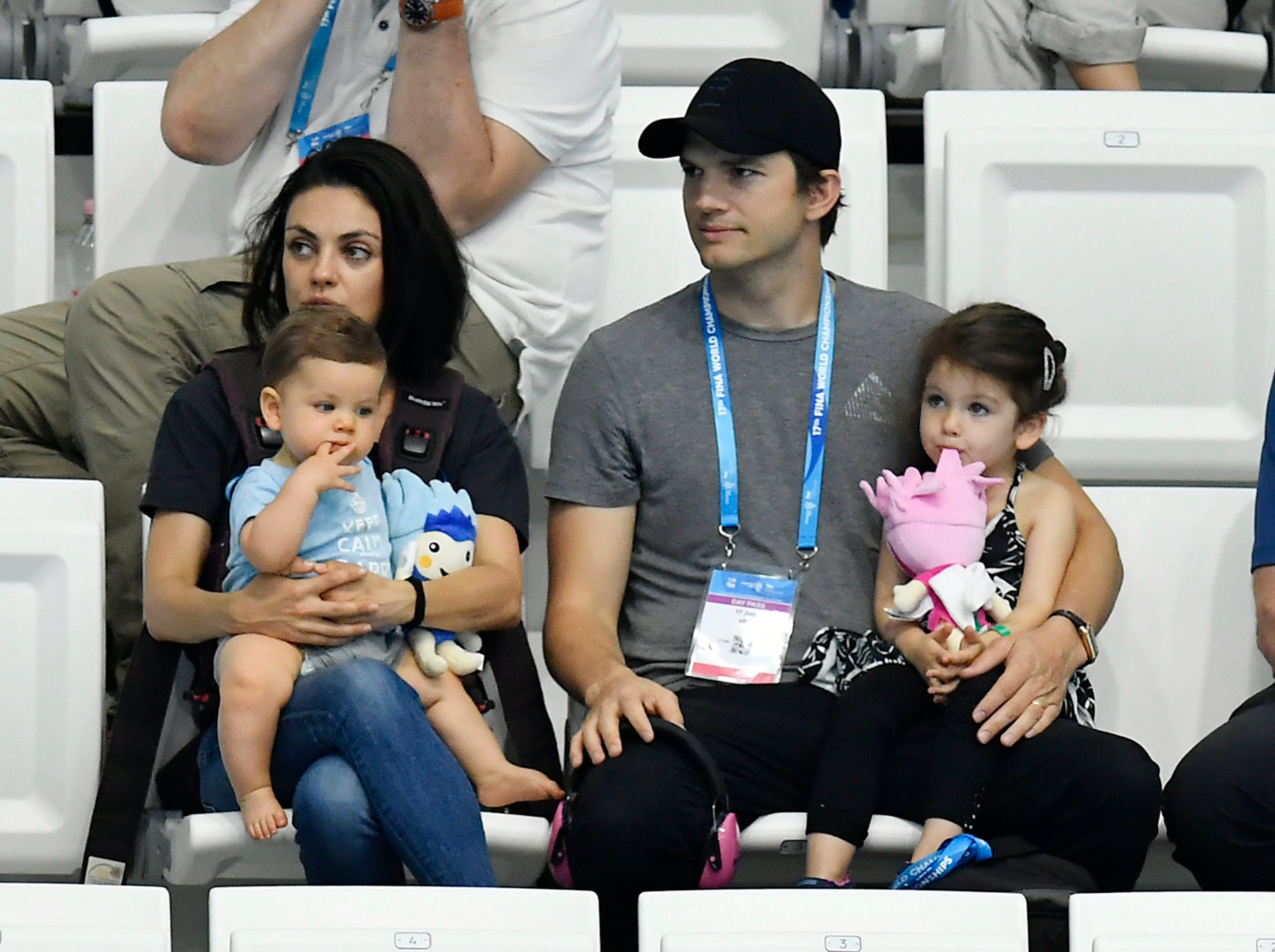 Ashton and Mila with their children