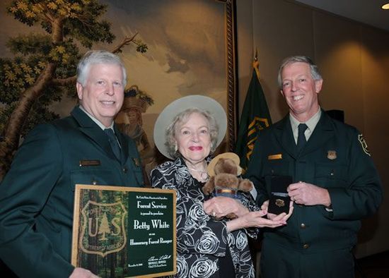 Betty White receiving her honorary forest ranger certificate