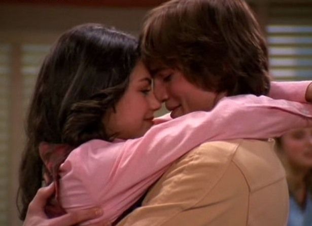 Ashton and Mila kissing on the set of That 70's Show