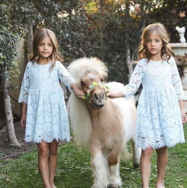 Leah and Ava Clements posing with a pony