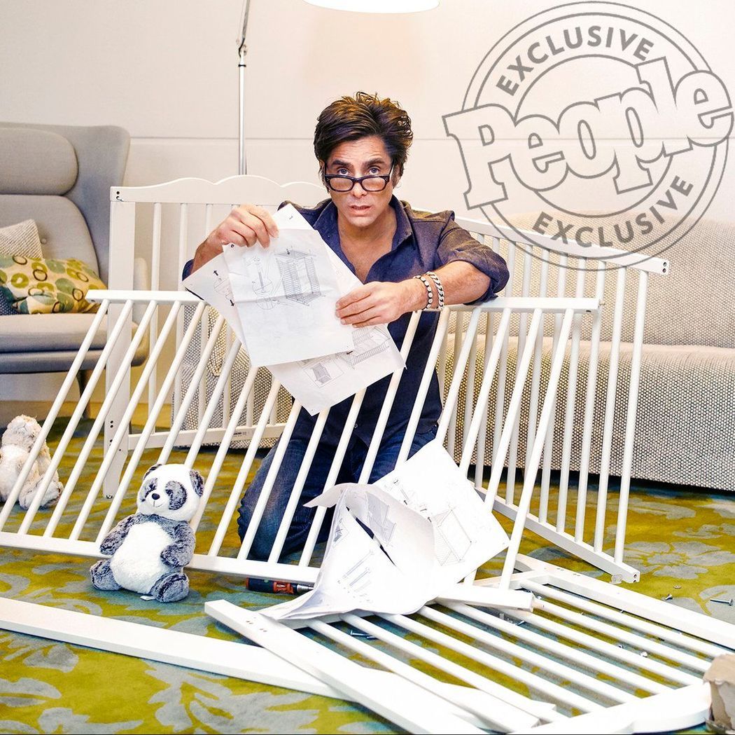 John Stamos trying to put together a crib