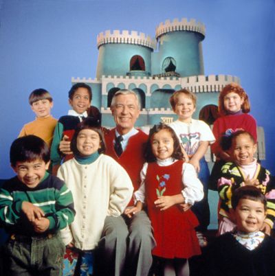 Mr. Rogers poses with a group of children