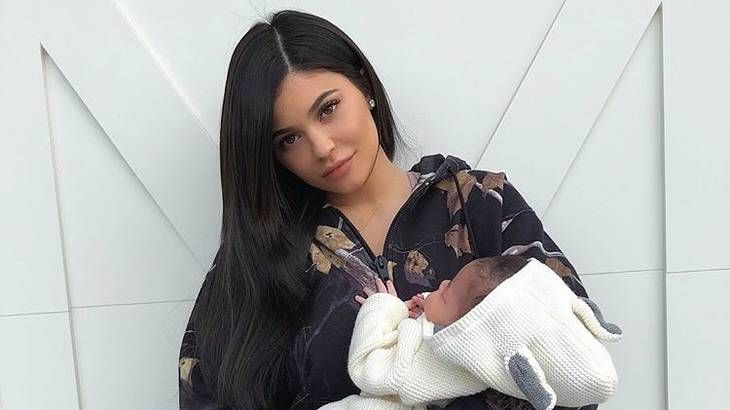 Kylie Jenner holding Stormi