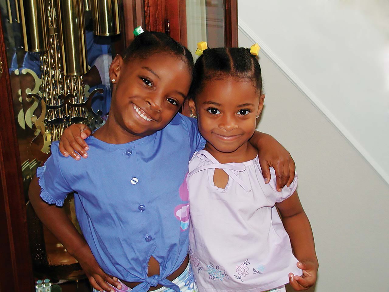 Simone Biles (left) and her sister Adria