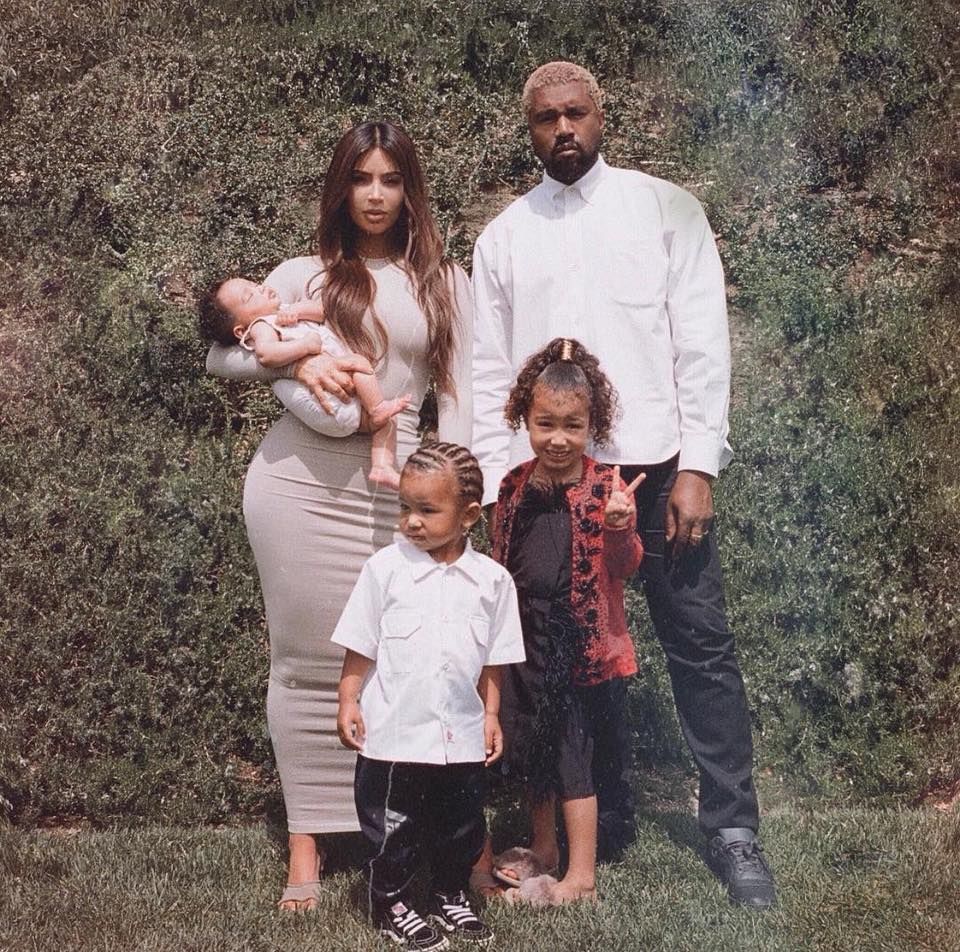 Kim Kardashian and her family posing for a picture