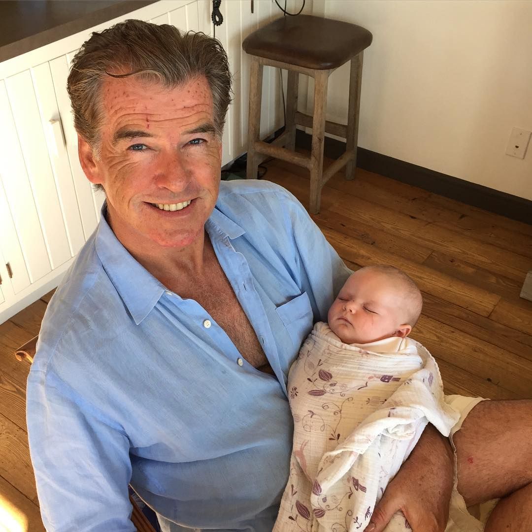 Pierce Brosnan with his granddaughter in the kitchen