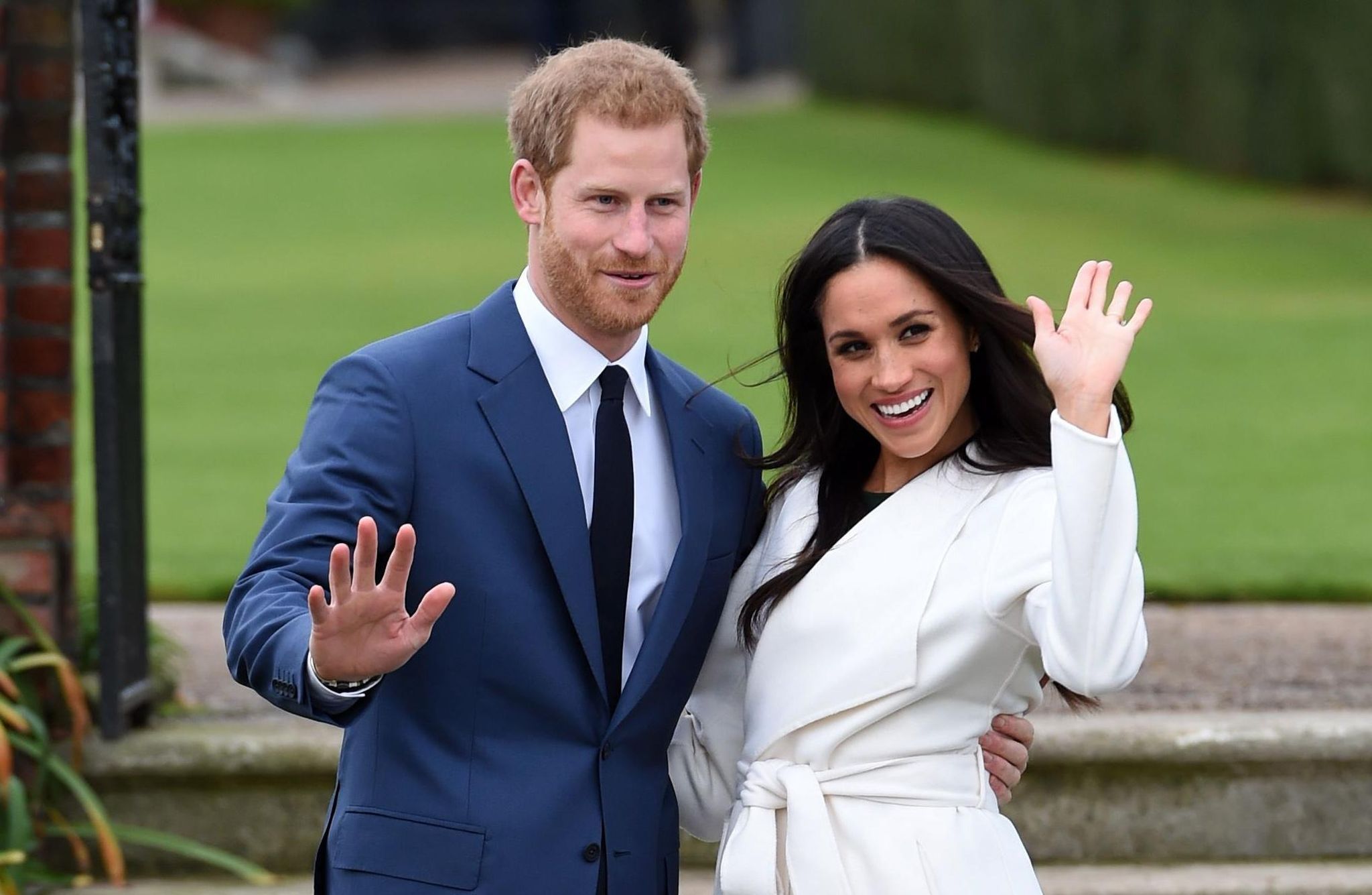 Prince Harry and Meghan Markle posing for the cameras