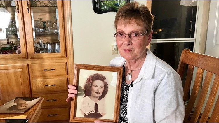 Linda Jourdeans shows off a photo of Rochelle Nielsen, the woman she believed was her mother