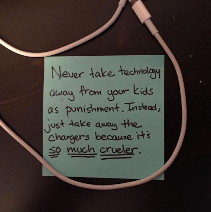 A post-it note with a phone charger