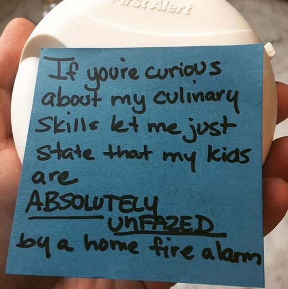 Post-it note on a fire alarm 