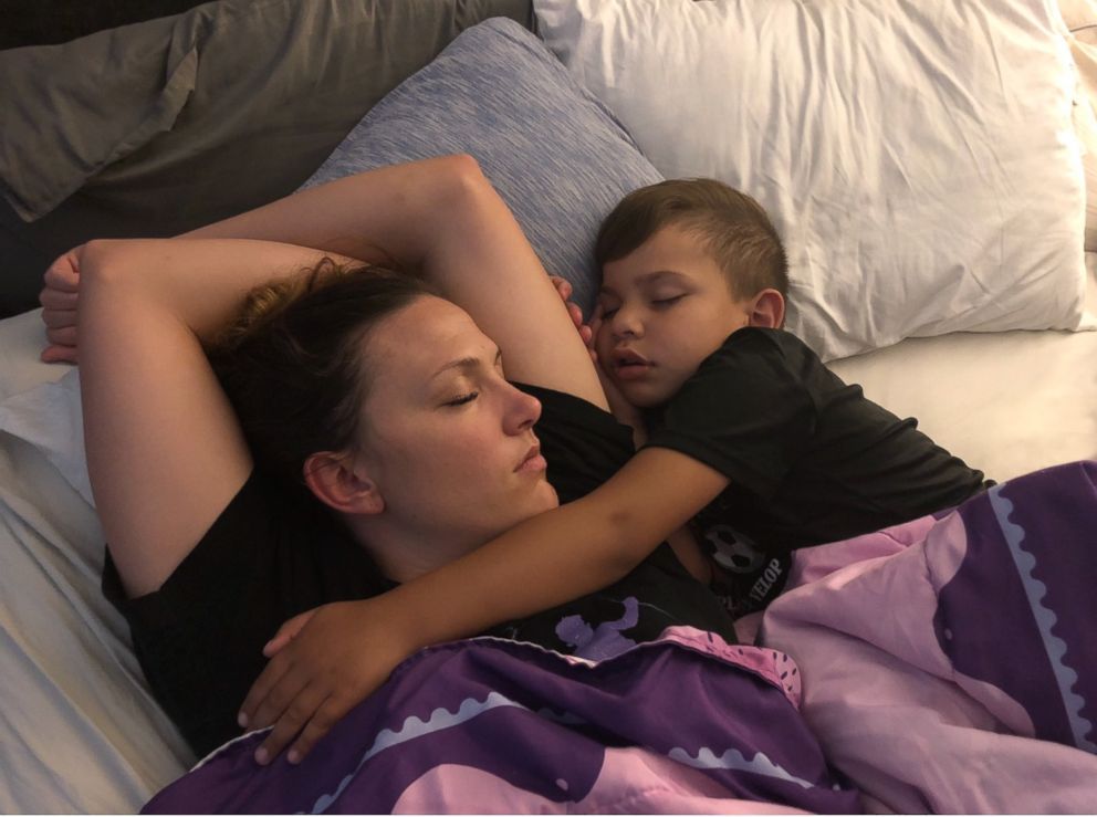 Carter and Jennifer sleeping in bed