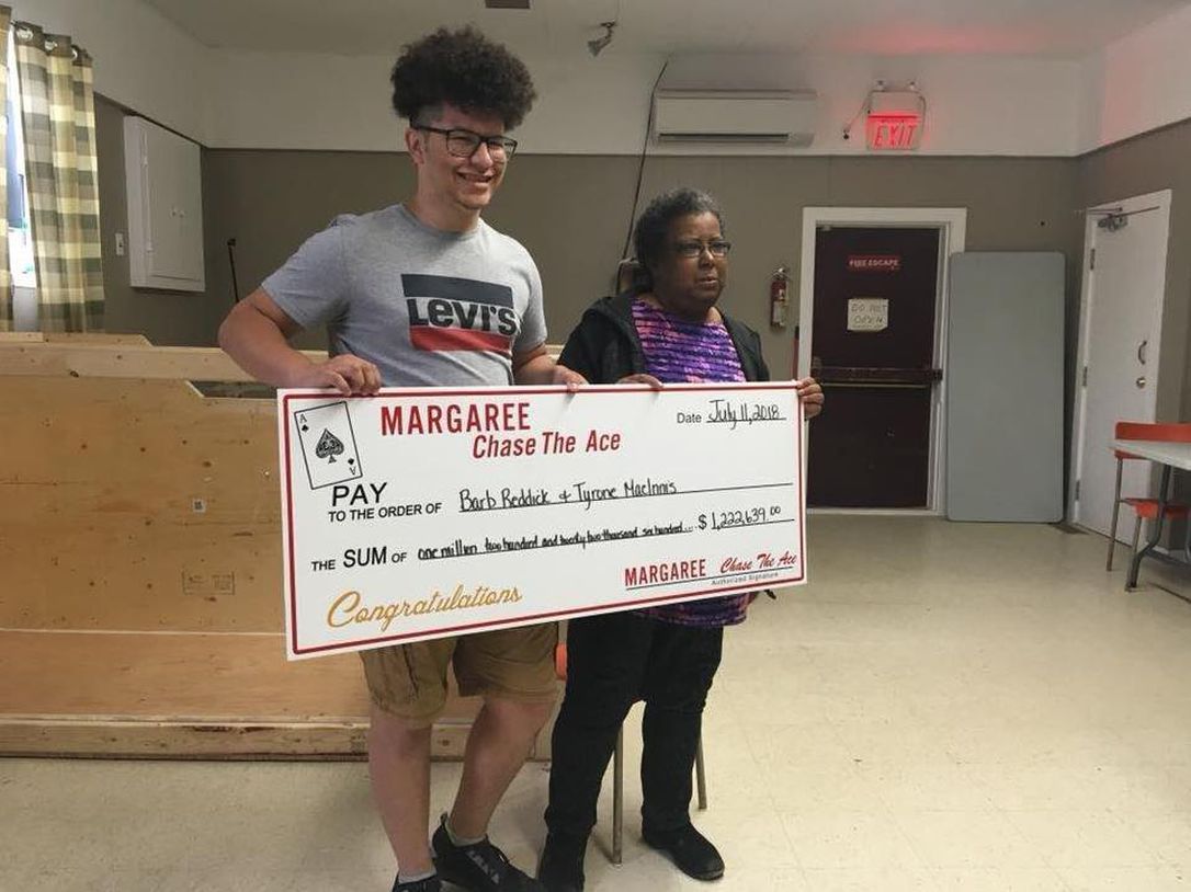 Barb and Tyrone with the big cheque