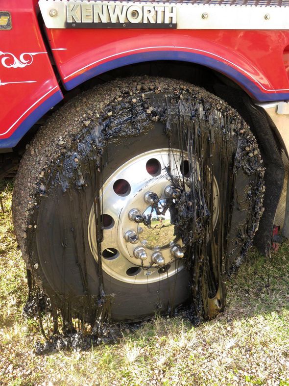 A tire covered in tar