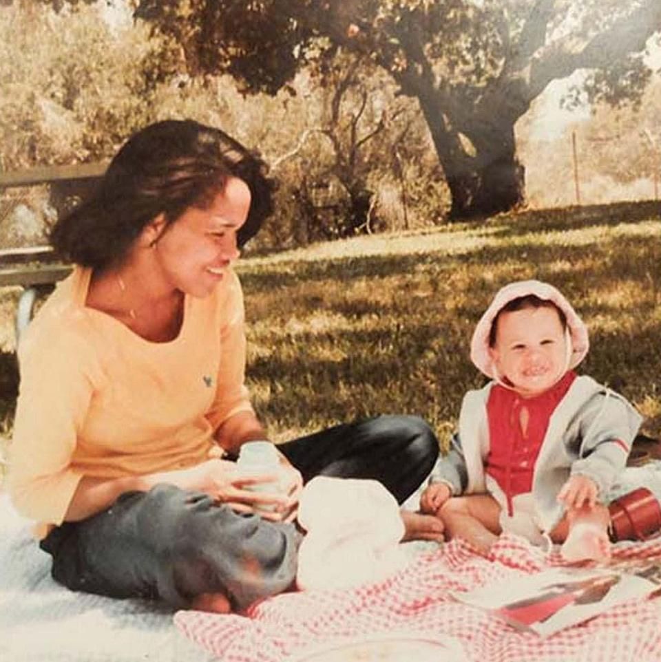 A baby Meghan Markle with her mom