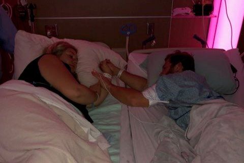 Andrew and Ashley Goette in hospital beds