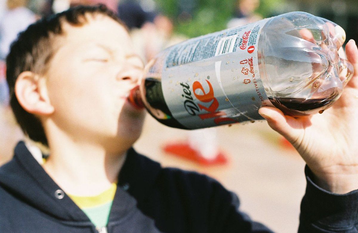 A boy drinking Diet Coke