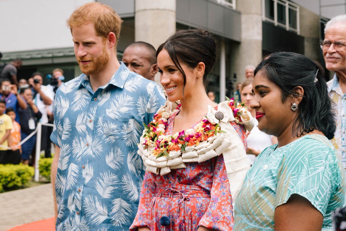 Meghan and Harry pose with Elisha Azeemah Bano, the founder of the Act It Network.