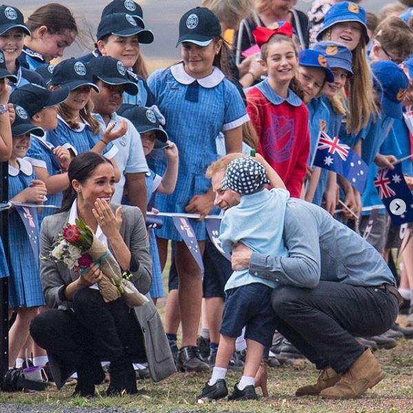 Prince Harry is embraced by preschooler Luke