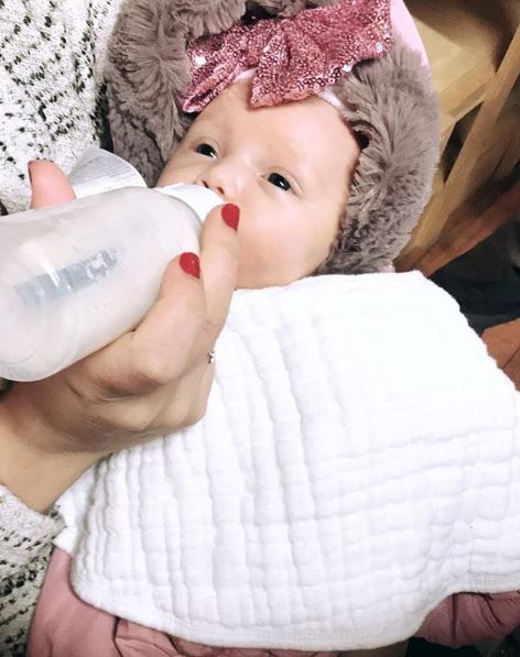 Meghan Koziel baby bottle feeding