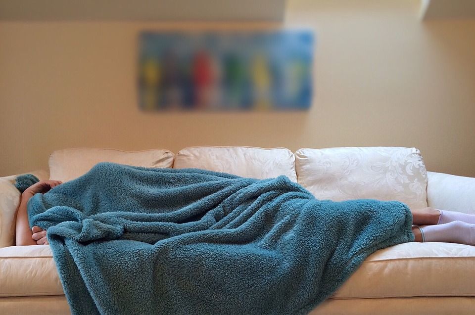 Sleeping person on couch