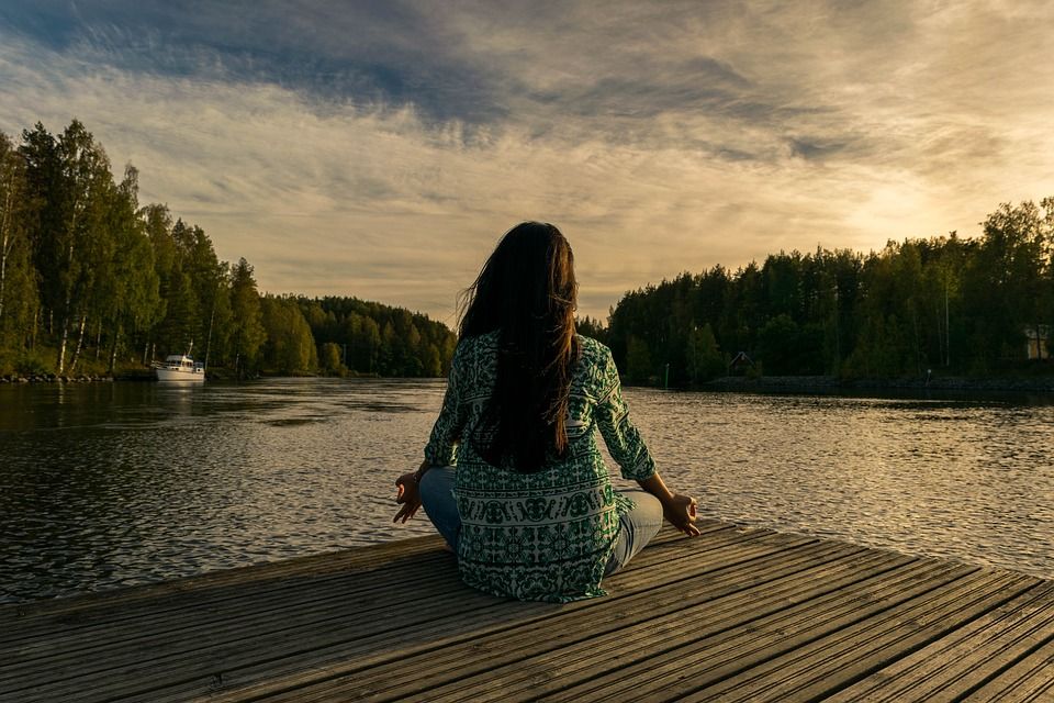 Woman meditating outside