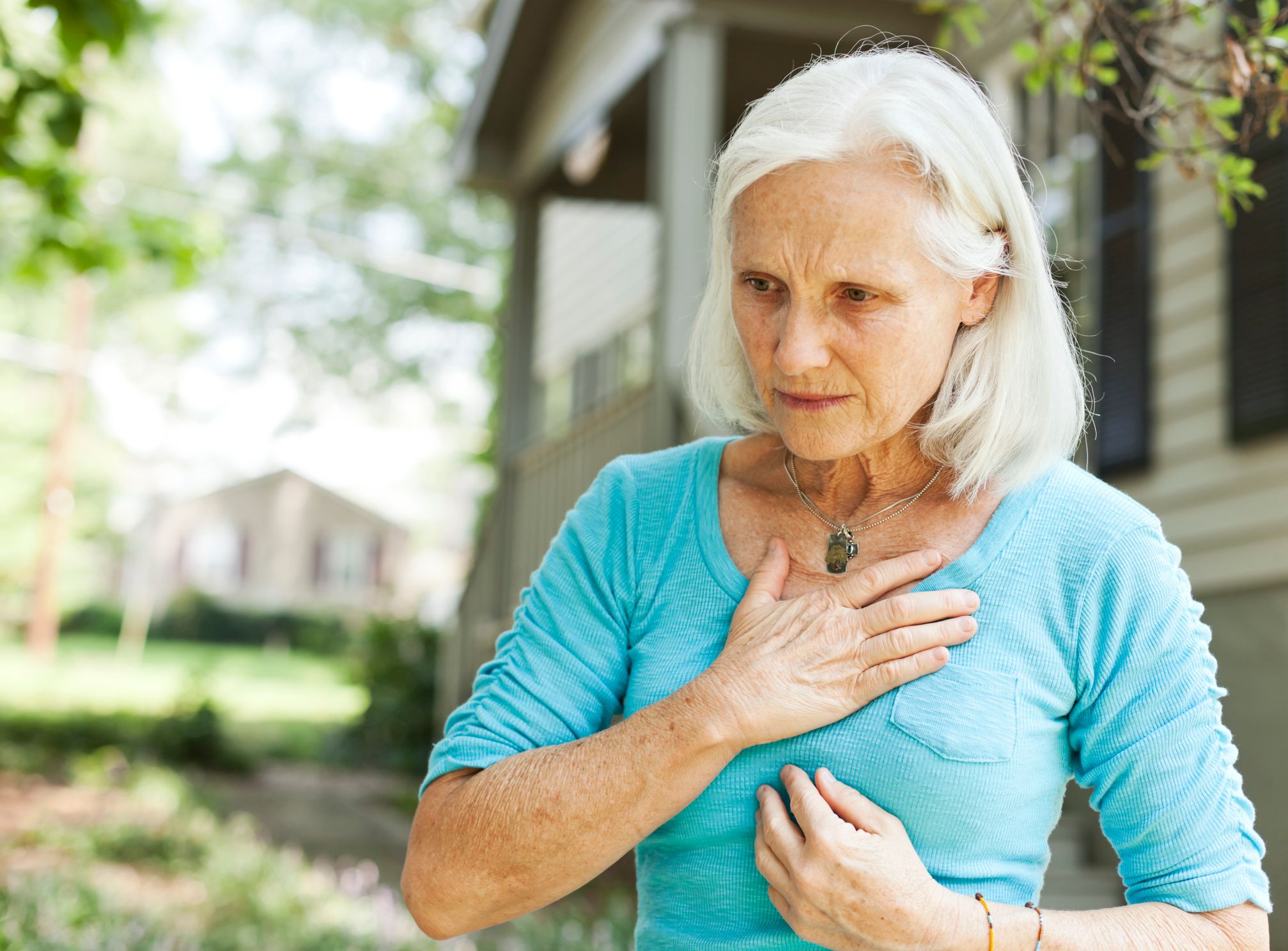 Woman with hands on her chest