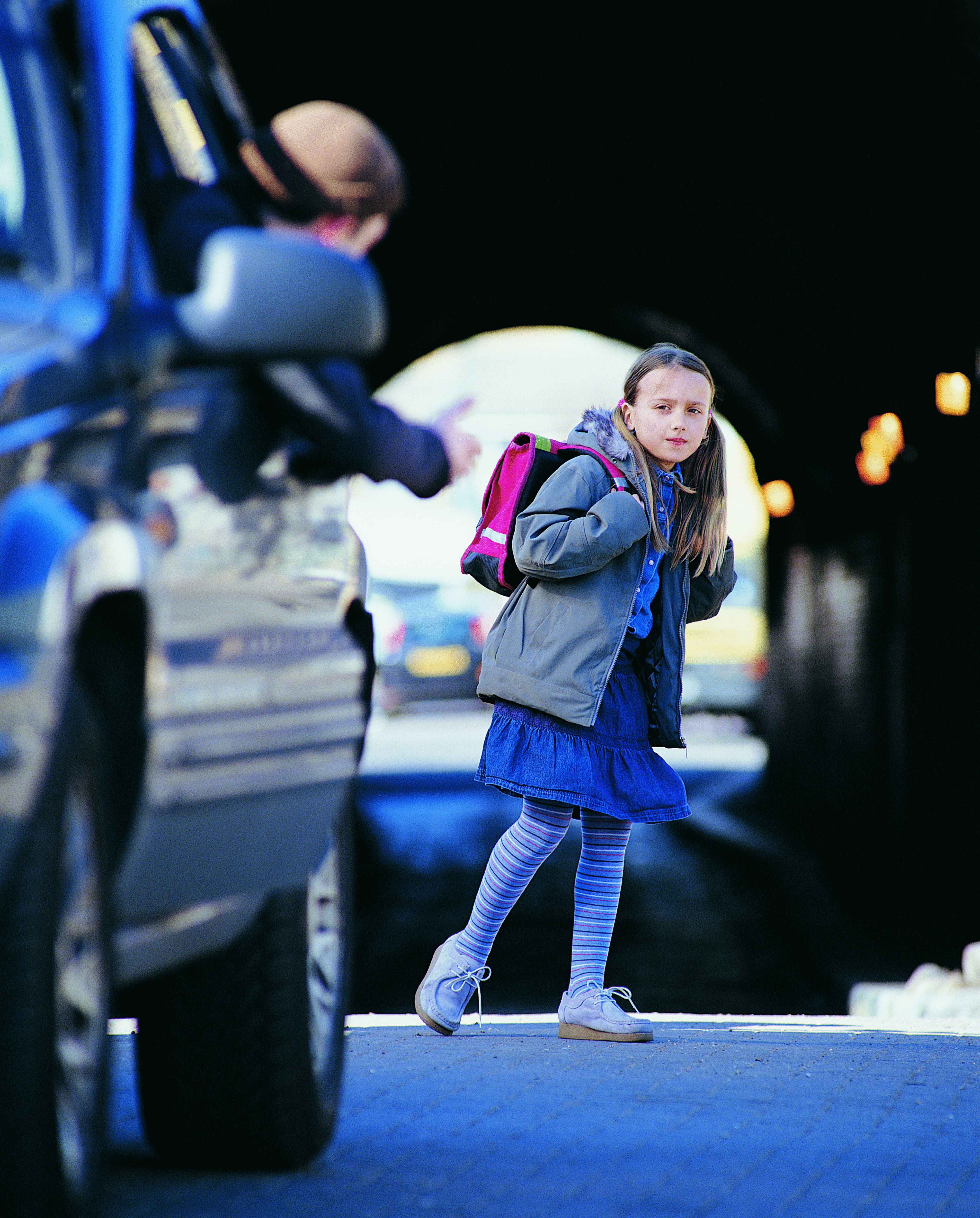 Man apprehending young girl