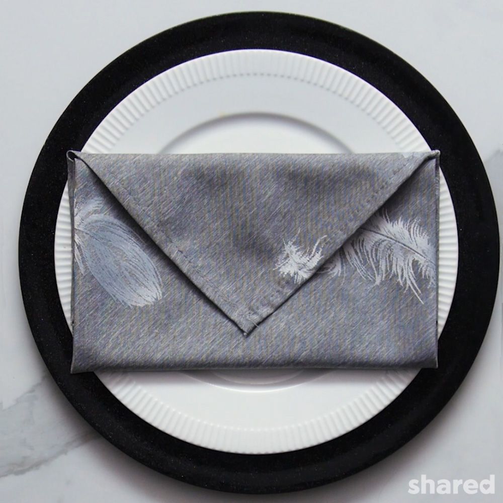 grey napkin folded into an envelope