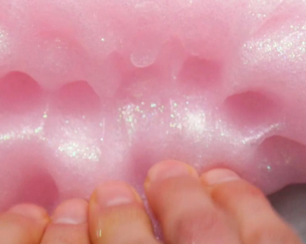 pink glitter slime being played with 