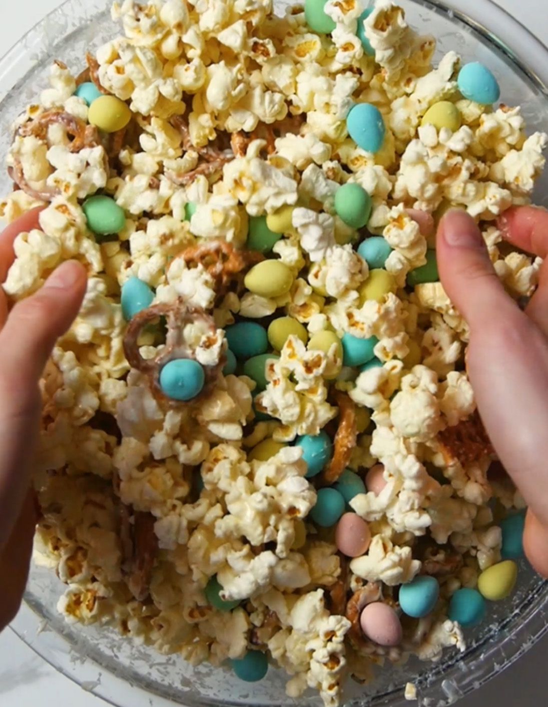 mini eggs being mixed into popcorn