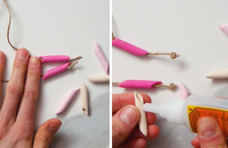 dark pink penne pasta tied onto hemp necklace string