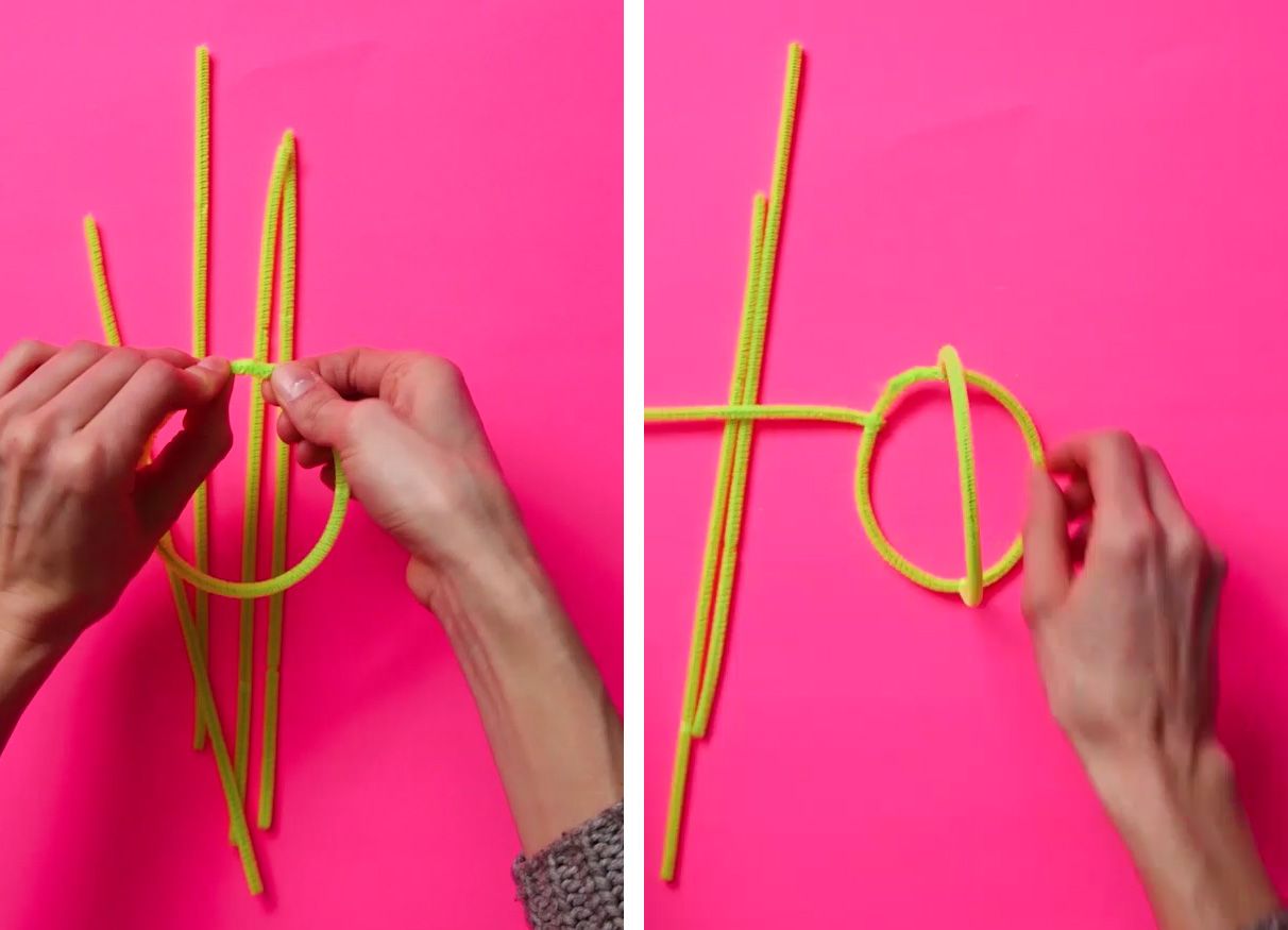 base of a pipe-cleaner cactus craft on a neon pink background