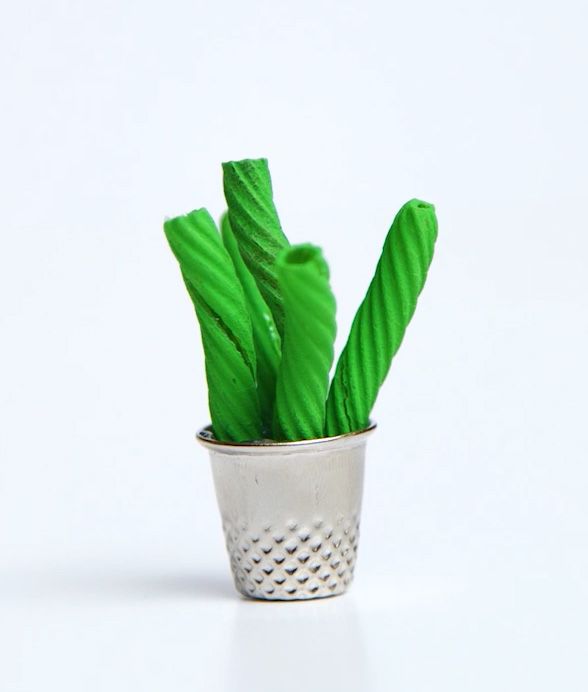 green pasta noodles glued into a thimble to look like a cactus
