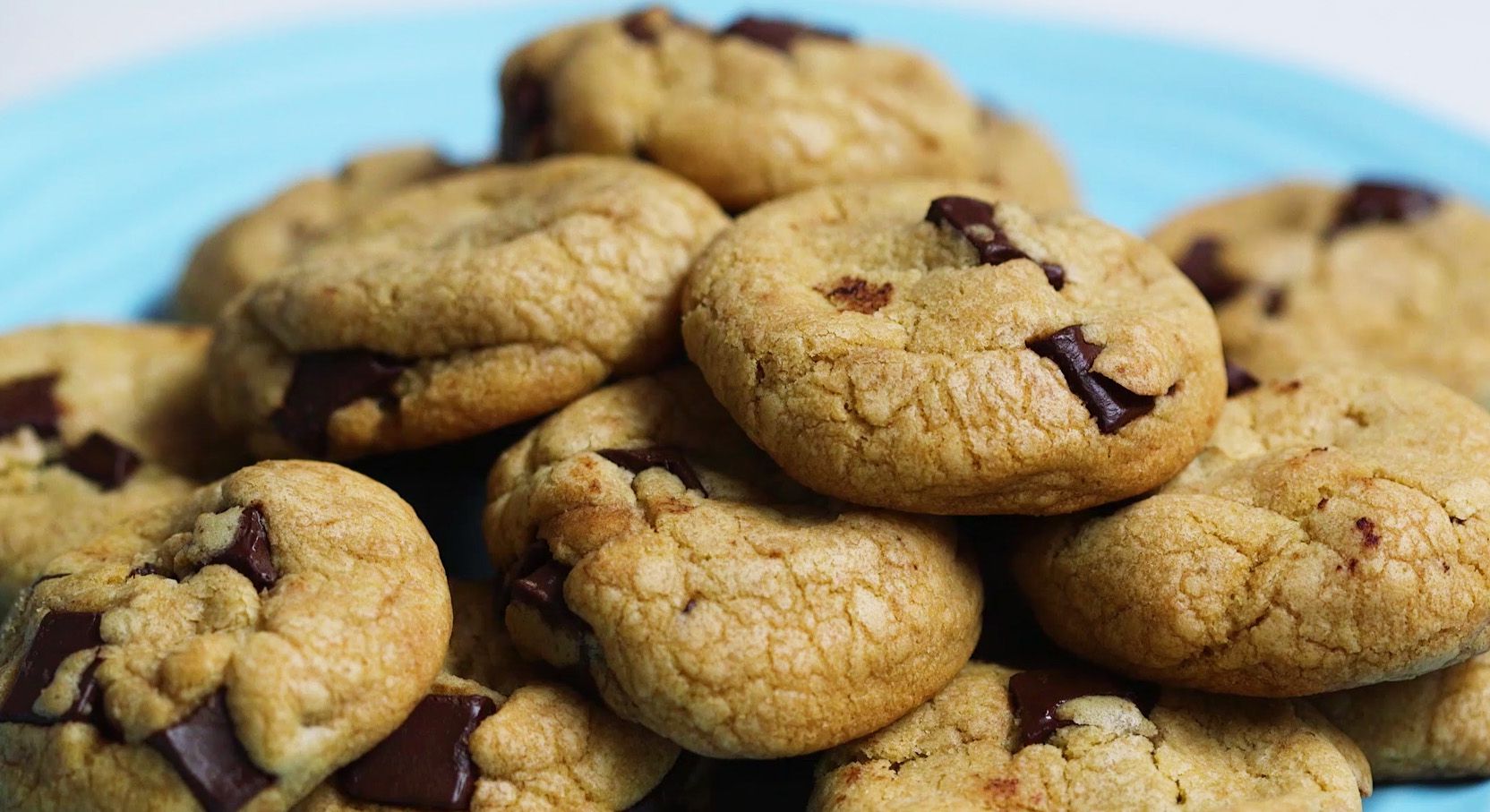 fresh chocolate chip cookies on a light blue plate