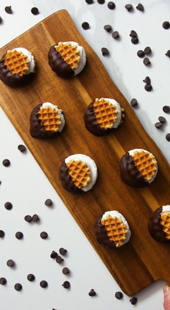 waffle wafer smore sandwiches on a wooden serving tray 