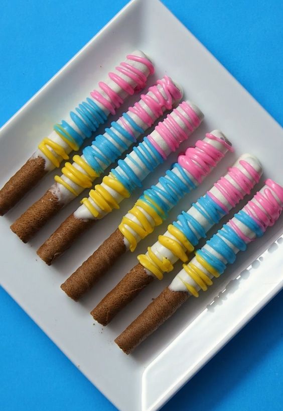 hazelnut unicorn wafer sticks on a white serving plate