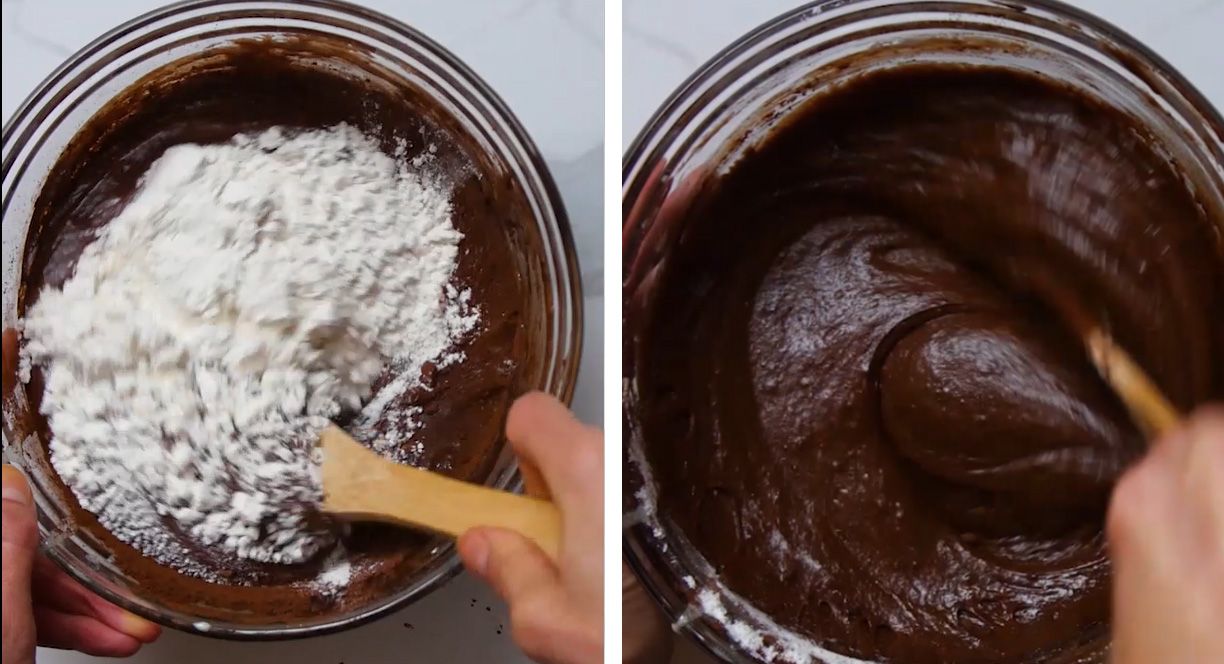 flour being stirred into brownie batter