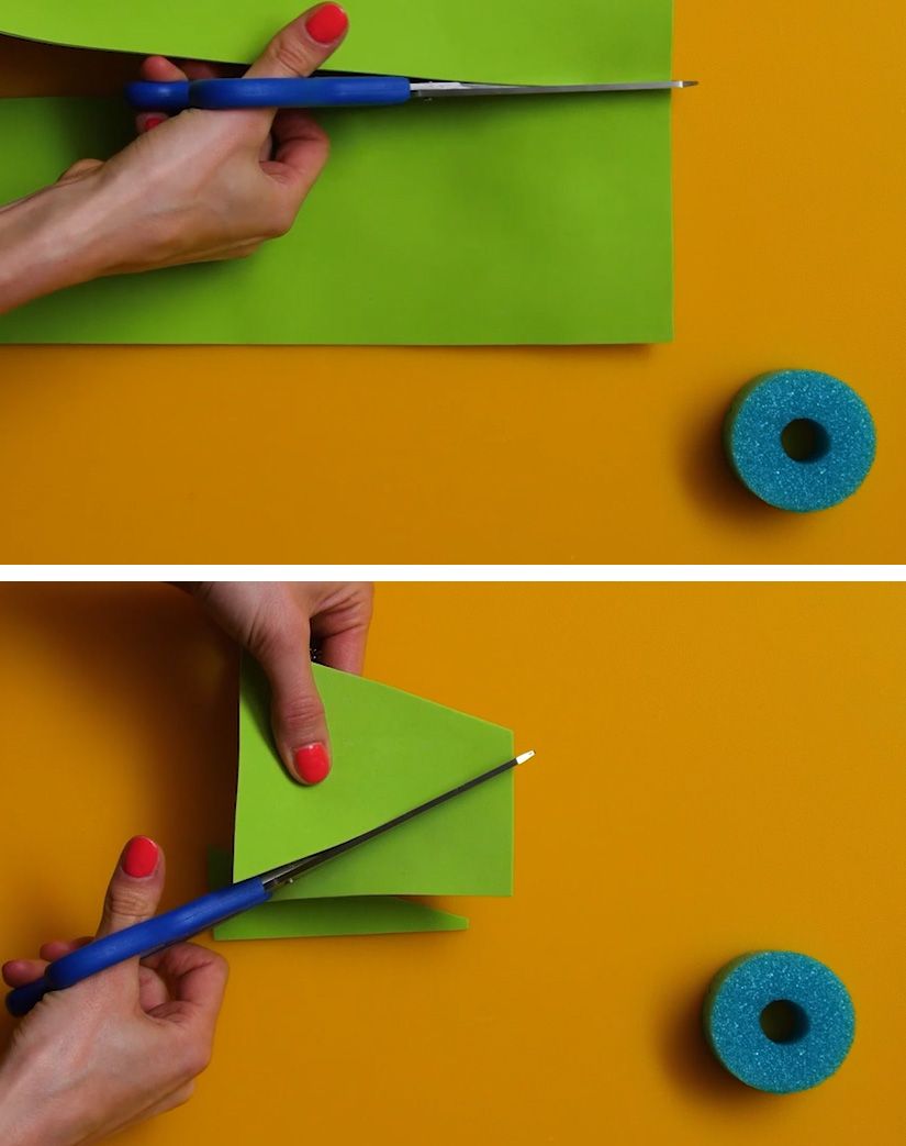 green foam paper craft sheet being cut into a triangle