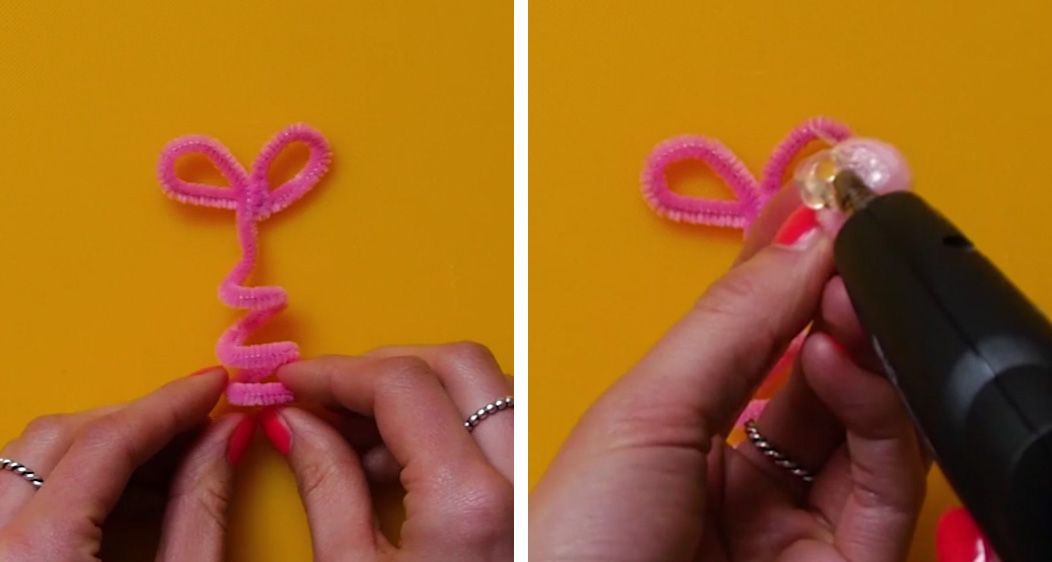 shaped pipe cleaner and pom pom being glued with a glue gun